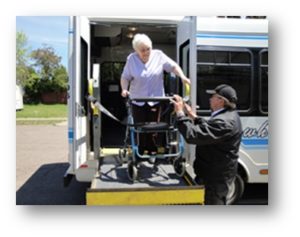 Woman with walker being assisted by the driver of a lift-assisted bus in Duluth, MN